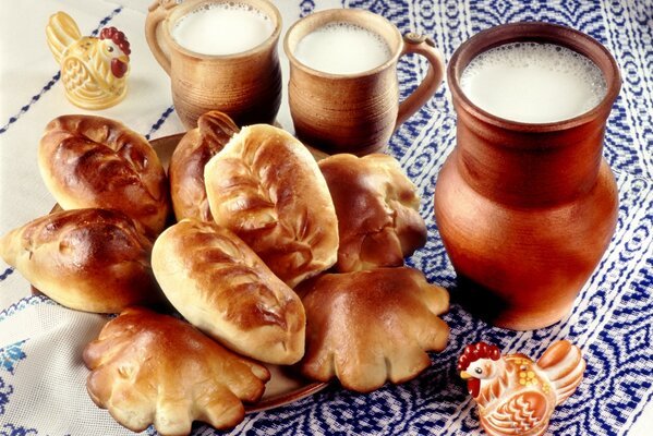 Pies from the oven and milk in a jug