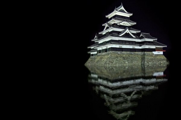 Reflection of a stone castle in the water