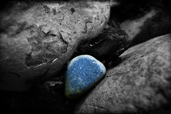 Black and white photo with a blue stone in the center