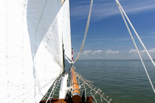 Yacht with white sails at sea