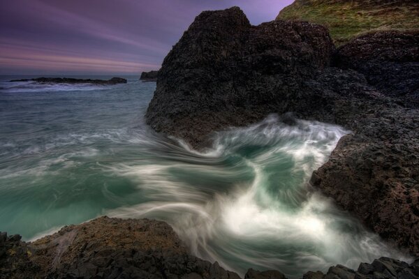 The sea raged among the stones