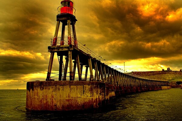 Red lighthouse in cloudy weather