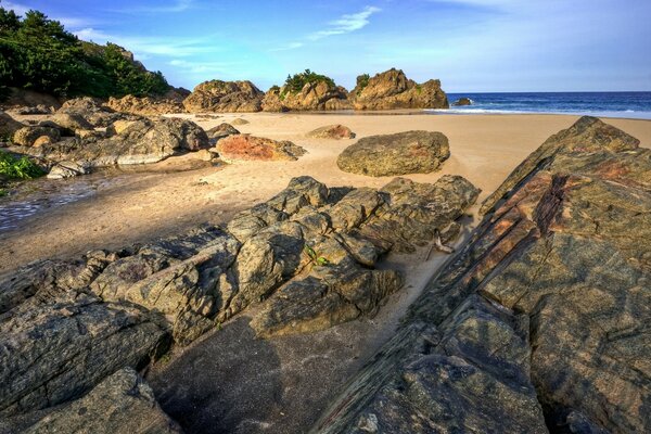 Sandy seashore with rocks