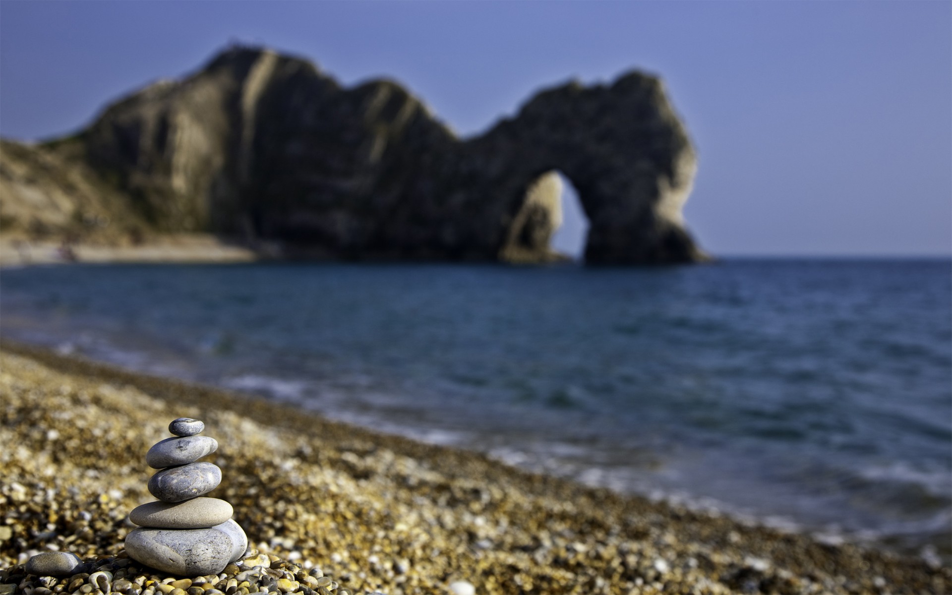 steine strand grotte meer kiesel england