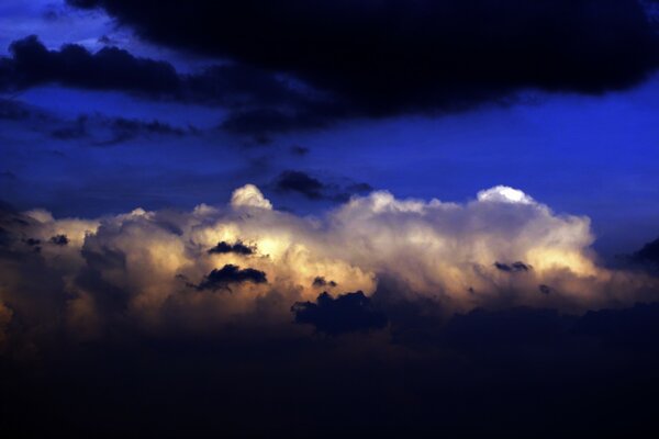 Night sky and clouds together next to clouds