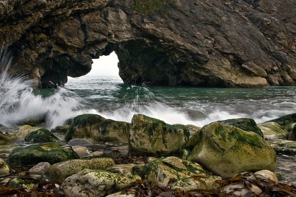 Water hitting rocks with splashes