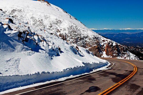 Bypass road in the mountains with snow