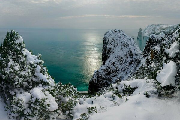 Snow-covered winter rocks near the Black Sea in Crimea