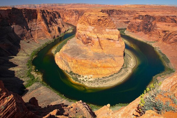 Water and grass in a rocky canyon