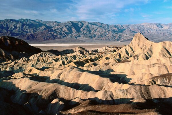 Sandy mountains under a blue sky