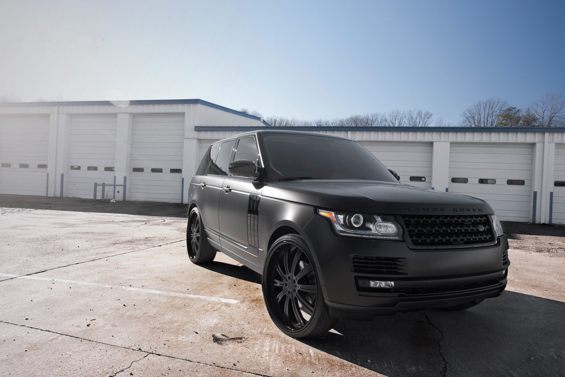 land rover range rover matte black land rover range rover matte black front view building white sky tree