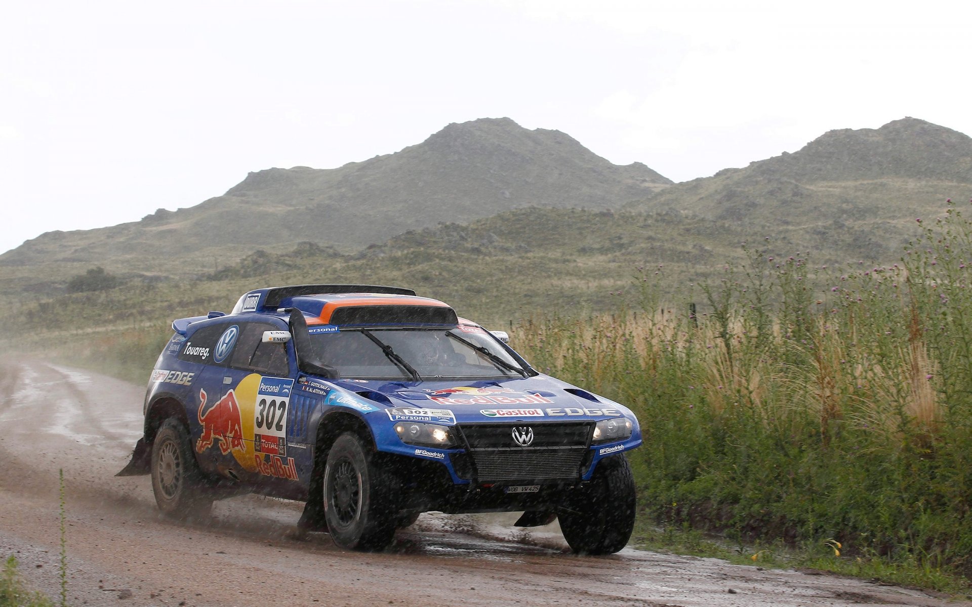 volkswagen tuareg azul dakar rally deporte suv lluvia nublado frente