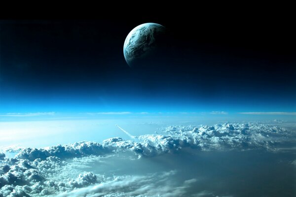Vista de las nubes desde el espacio. El lado visible del planeta en el fondo del espacio