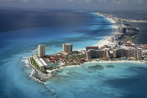 Houses with a beach in the middle of the ocean