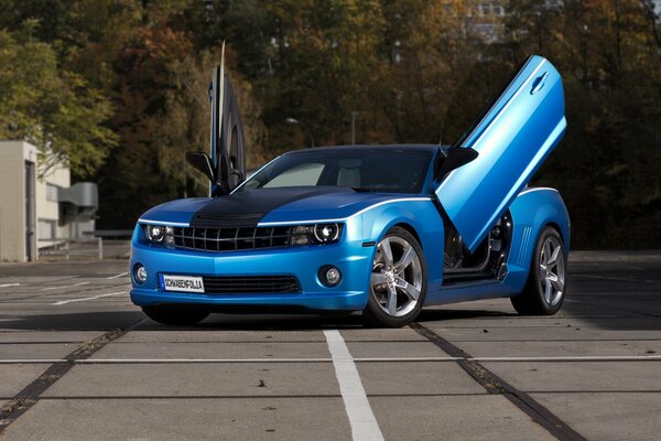 Blue Chevrolet car with open doors