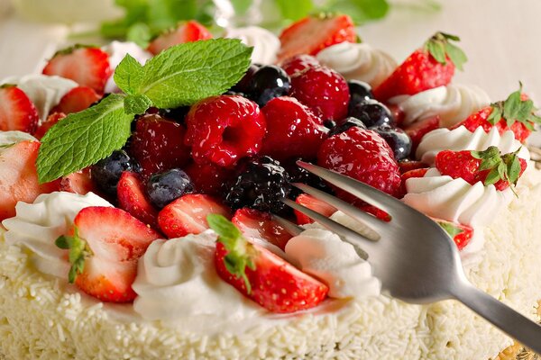 Cream cake with cream and various berries