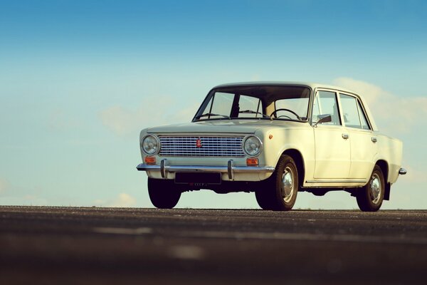 White Lada against the sky