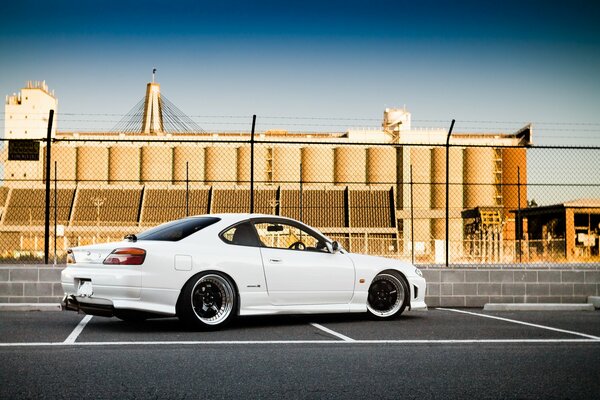 White tuned Nissan rear view