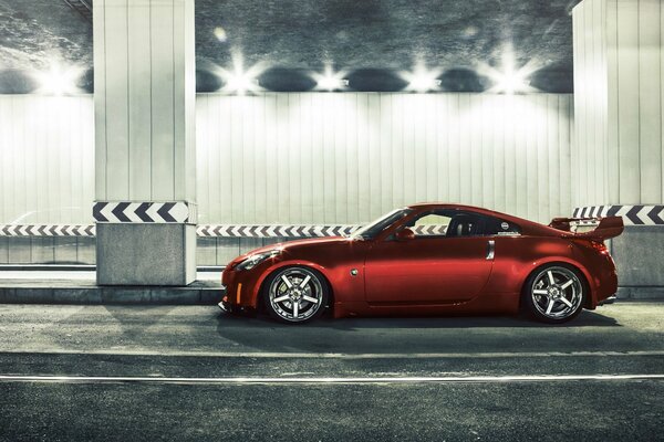 Red tuned Nissan in the tunnel