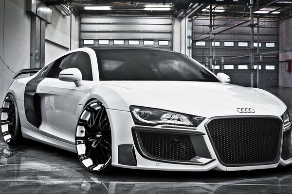 White Audi with luxury wheels of unusual color