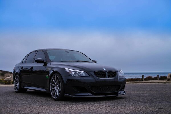 Elegant BMW on the background of nature and the sea