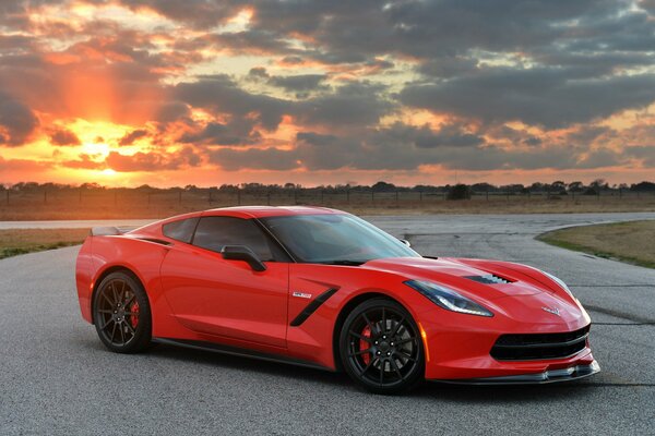 Chevrolet car on the background of the setting sun