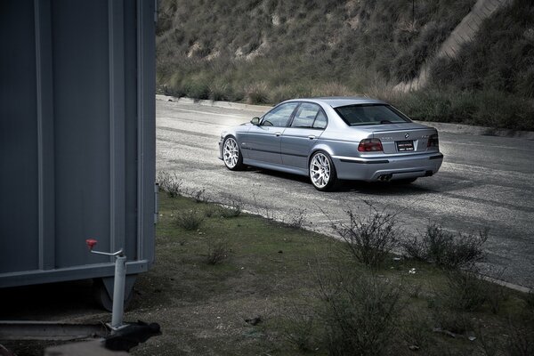 Bmw rear view on the road background