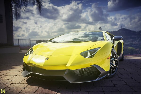 Lamborghini aventador supercar on the background of clouds