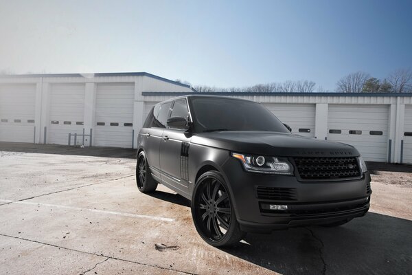 Black matte Land Rover and blue sky