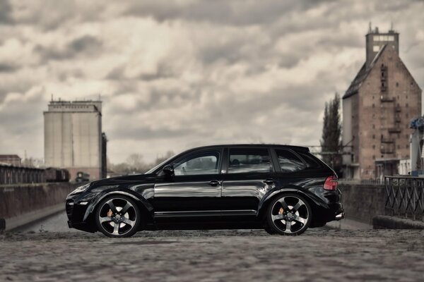 Foggy sky and black car