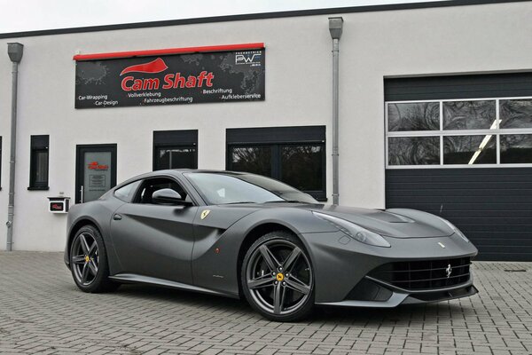 Grey ferrari f12 car on the street