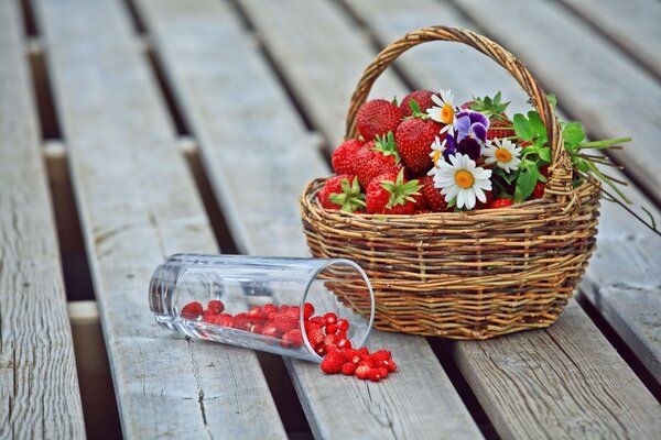 Summer flowers and berries in a basket