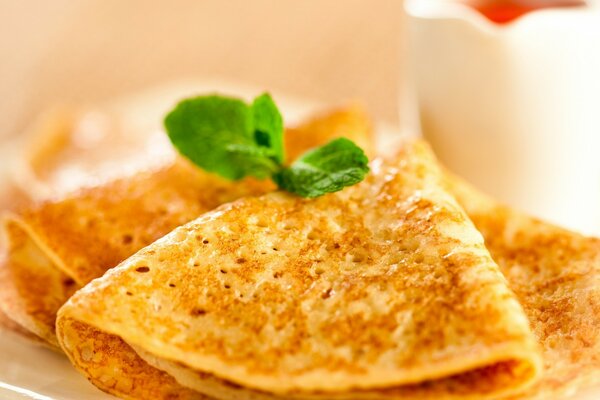 Breakfast of tender pancakes with herbs