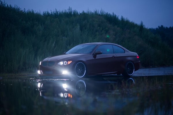 She does not just drive but swims on the reflection