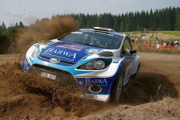 The front of the Ford on the turn during the rally