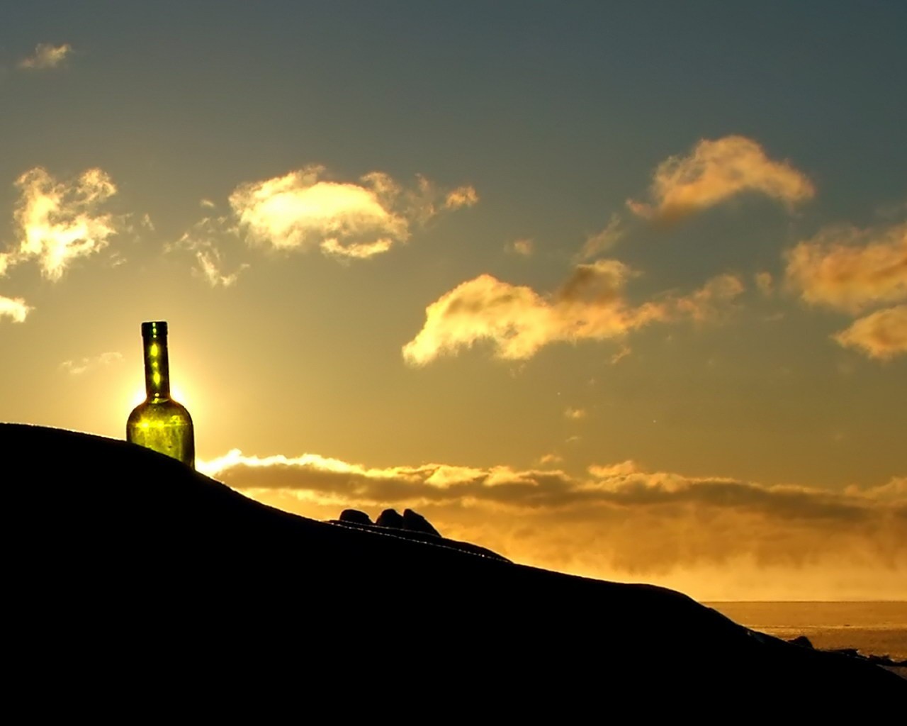 a bottle clouds sky sunset