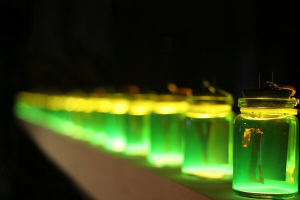 Light green jars with luminous liquid