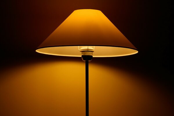 The lamp illuminates with a warm yellow light