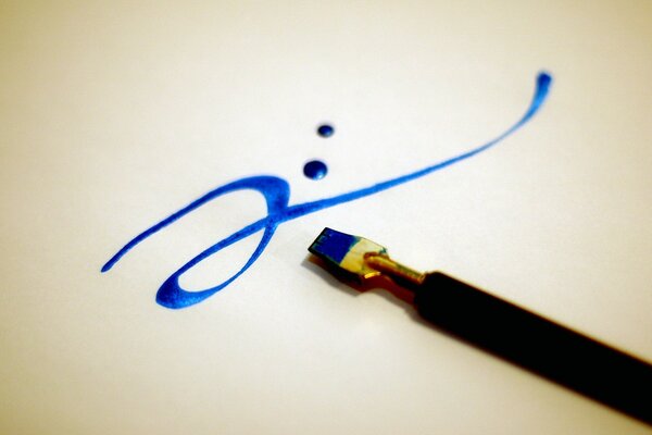 Calligraphy blue paint with a brush