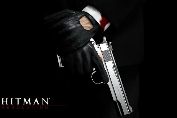 The logo of the game hitman and a gun in his hands