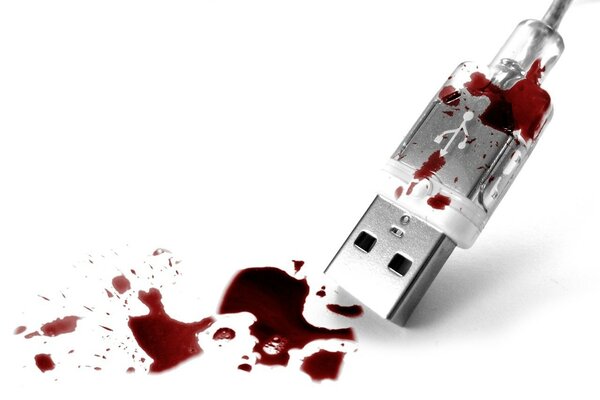 Usb razem and drops of blood on a white background
