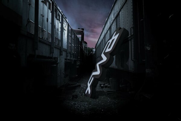 Image d une ville de nuit sombre avec une enseigne qui traîne