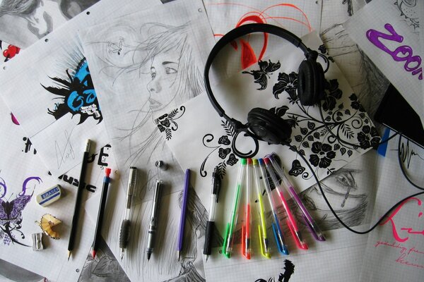 Multicolored pens with headphones in the drawings