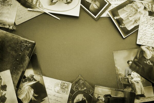 There are old photos in black and white on the table