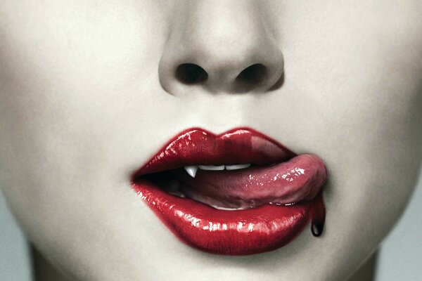 Bright scarlet vampire lips with a seductive tongue