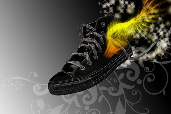 A painted black sneaker with bright wings