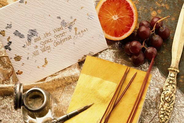 Vintage calligraphy set on fruit background