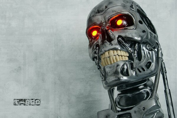 Terminator s head with burning eyes on a gray background