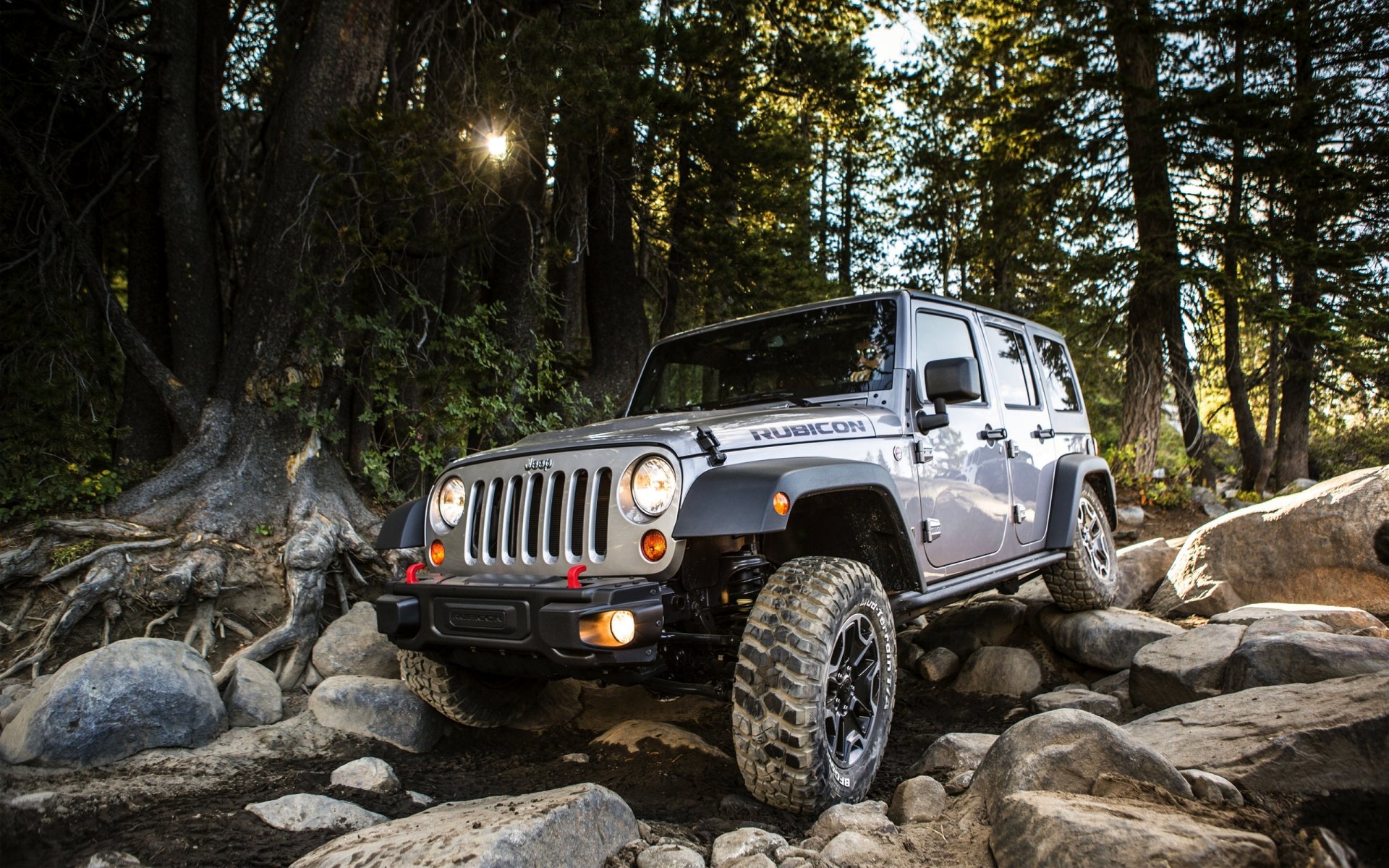 jeep wrangler unlim rubic suv fuera de la carretera frente piedras auto