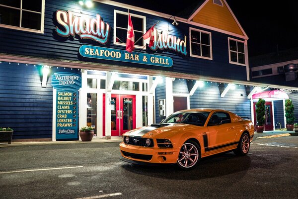 Orange Ford Mustang at the bar